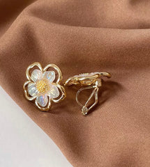 Clip on small gold and fluorescent white flower earrings