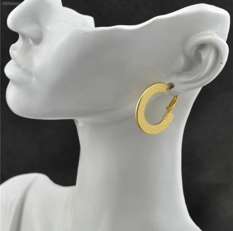 Clip on matte gold textured flat hoop earrings