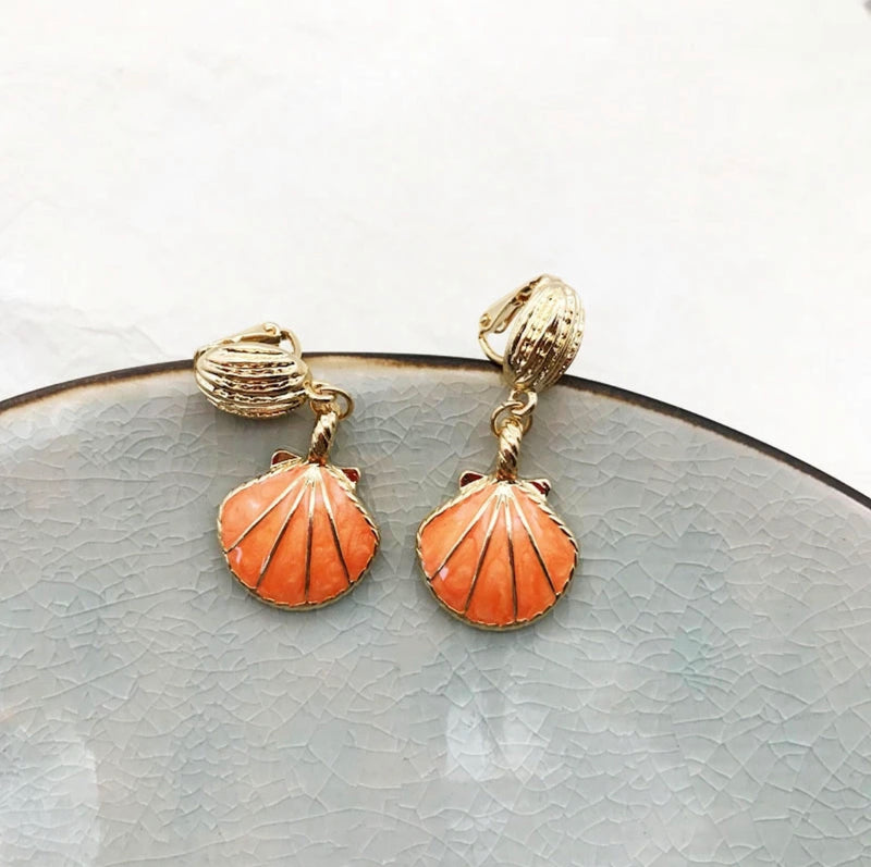 Clip on 1 3/4"  gold dangle orange shell earrings
