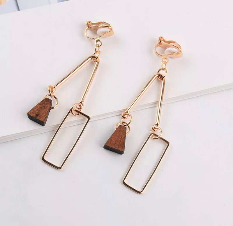 Unique clip on 2 3/4" gold wire and brown wood dangle earrings