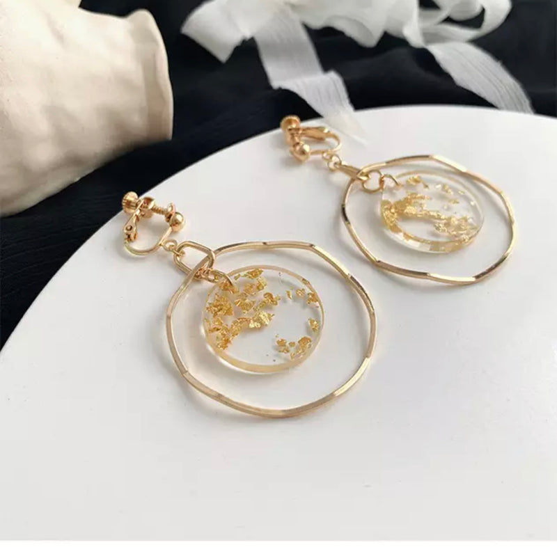 Clip on gold and glitter circle dangle wavy hoop earrings