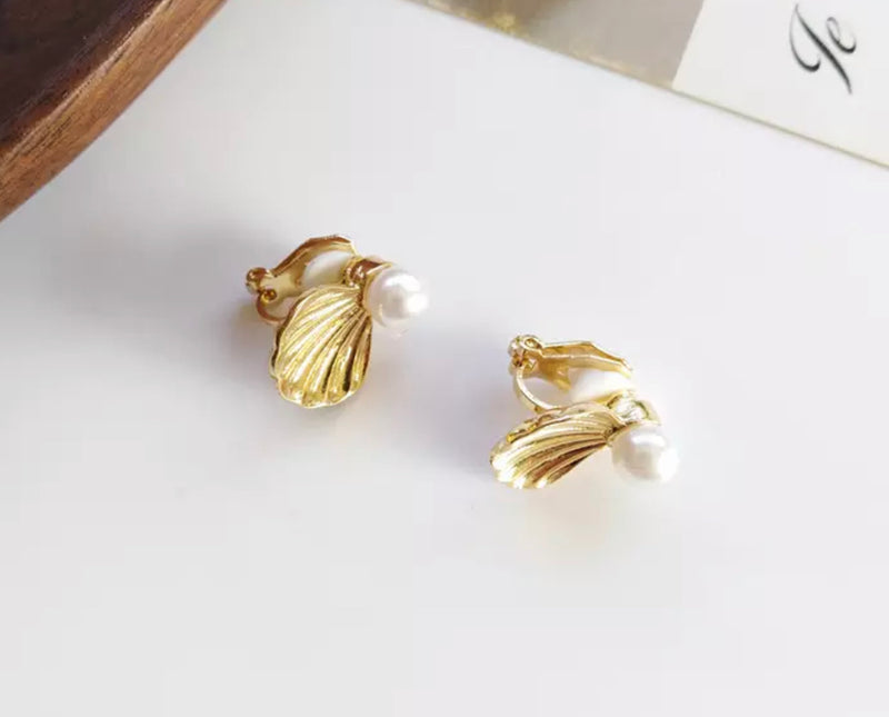 Clip on 3/4" gold shell and white pearl earrings