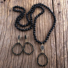 Trendy long pierced gold and black bead teardrop necklace and earring set