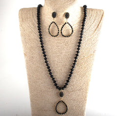 Trendy long pierced gold and black bead teardrop necklace and earring set