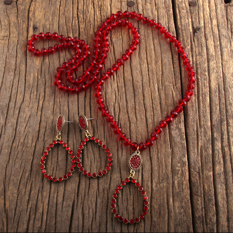 Trendy pierced long gold and red clear bead teardrop necklace and earring set