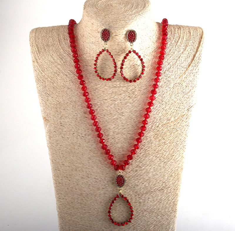 Pierced gold chain necklace set with brown stone and gold beads