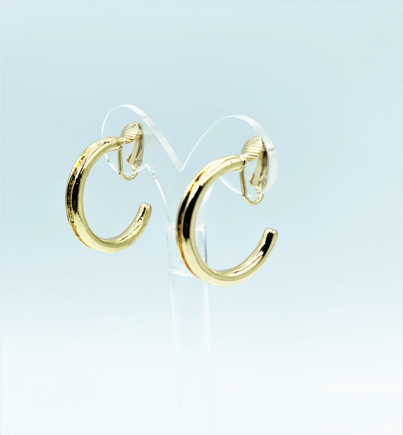 Clip on 1 1/4" shiny gold indented edge open back hoop earrings