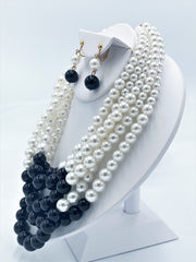 Beautiful clip on gold 5 strand black and white pearl necklace and earring set
