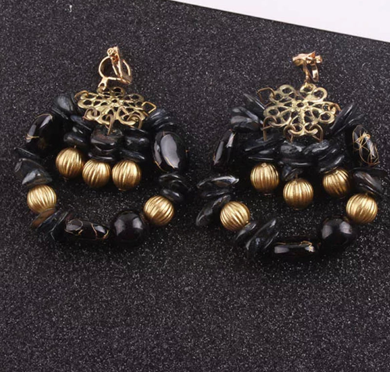 Clip on 2 1/2" brass black and white dangle beaded earrings