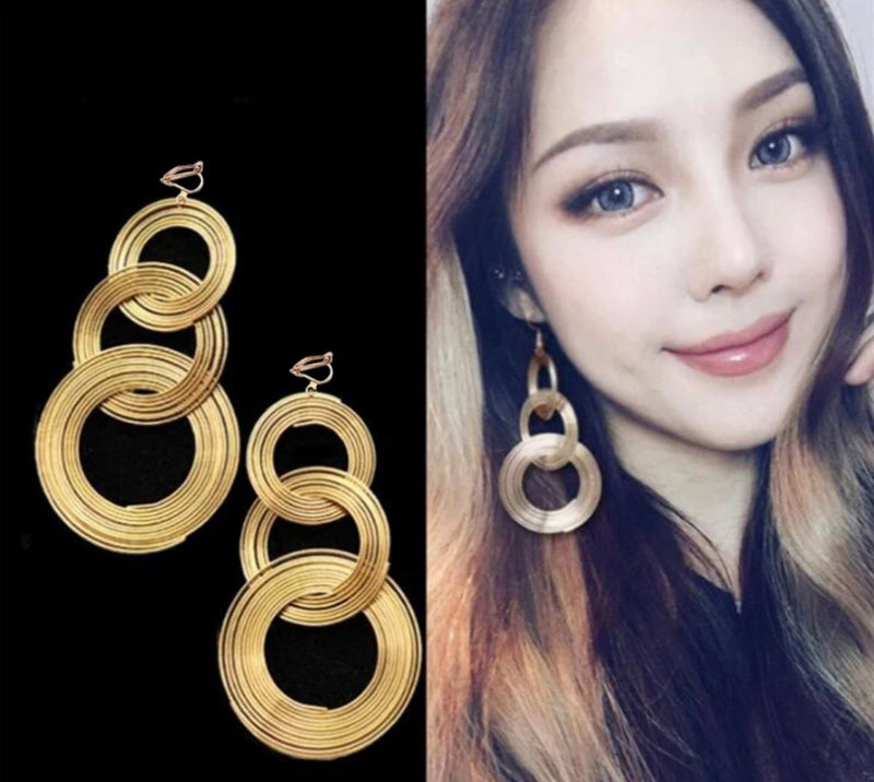 Clip on 1 3/4" gold textured spring back hoop earrings