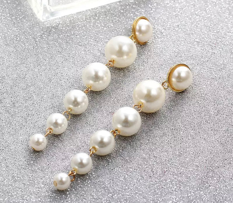 Clip on 3 1/4" gold and white pearl graduated dangle earrings