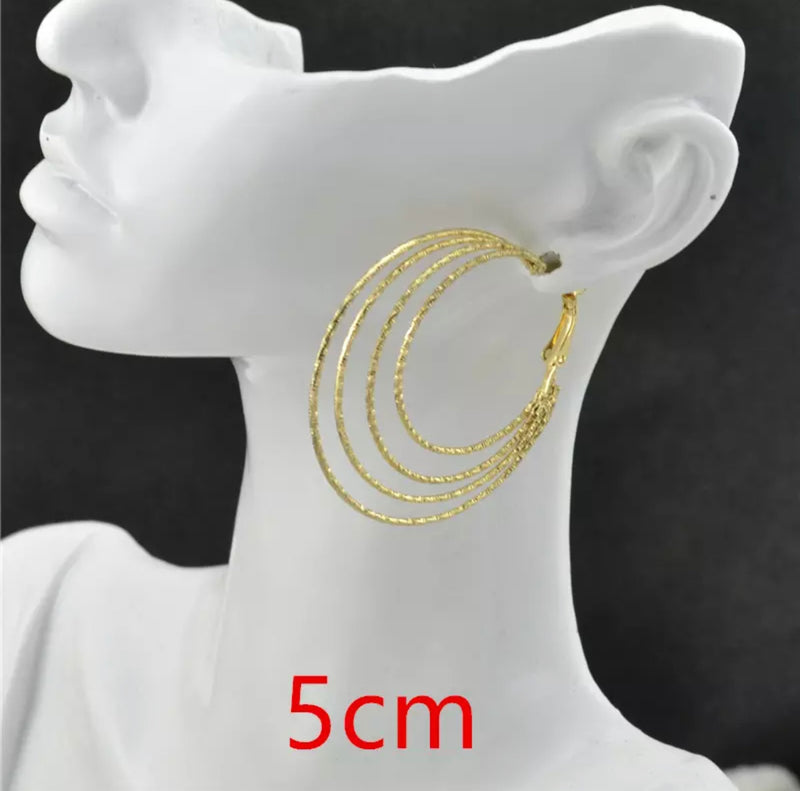 Clip on 2 1/2" textured gold three layer hoop earrings