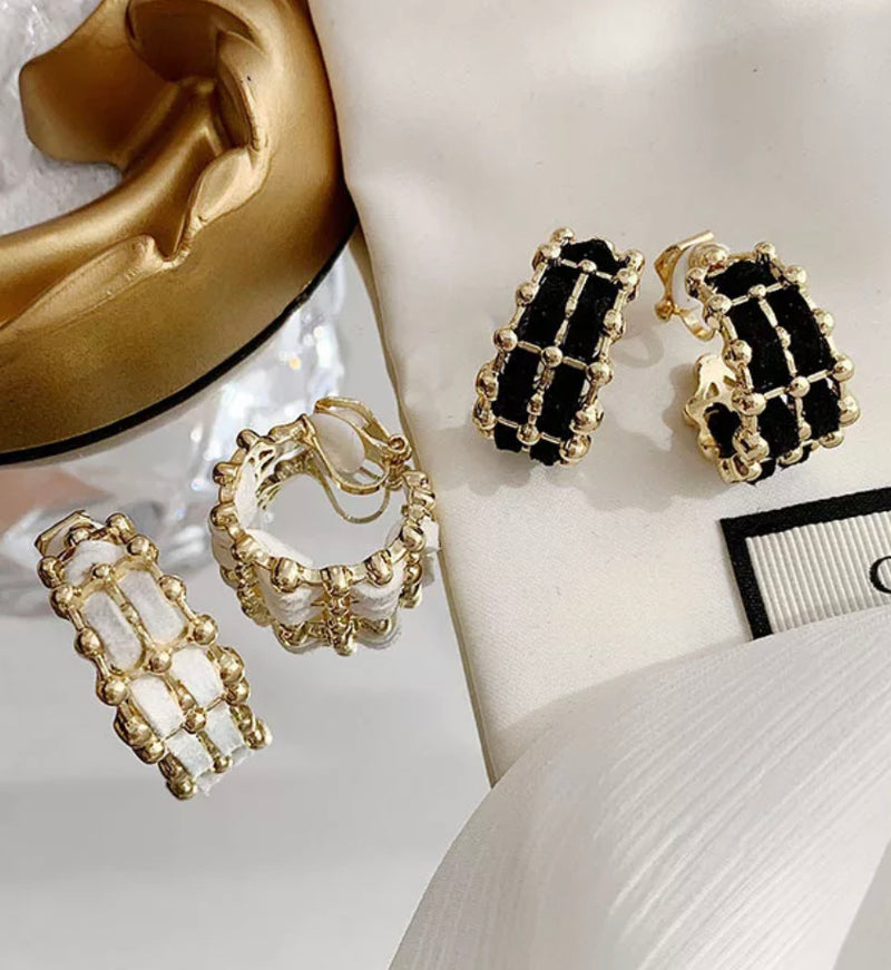 Clip on 1" gold with black or white woven style hoop earrings