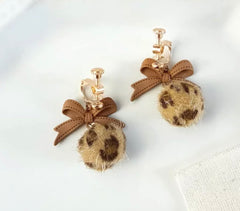 Clip on gold and brown bow and animal print fuss ball earrings