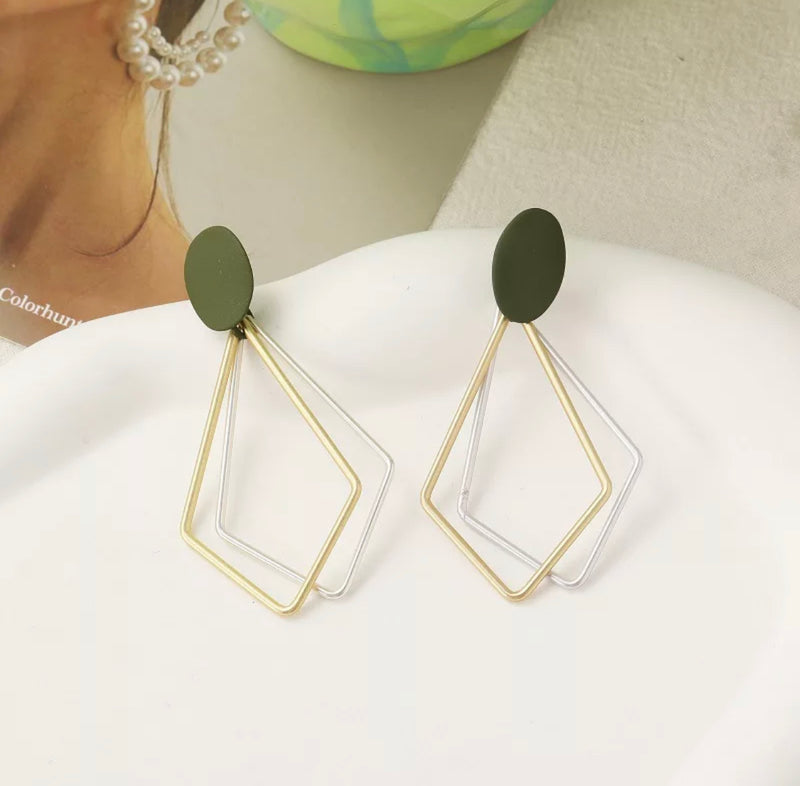 Clip on 2 1/2" matte gold, silver and green kite style dangle earrings