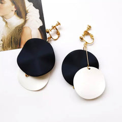 Clip on gold black and white wavy dangle circle screw back earrings