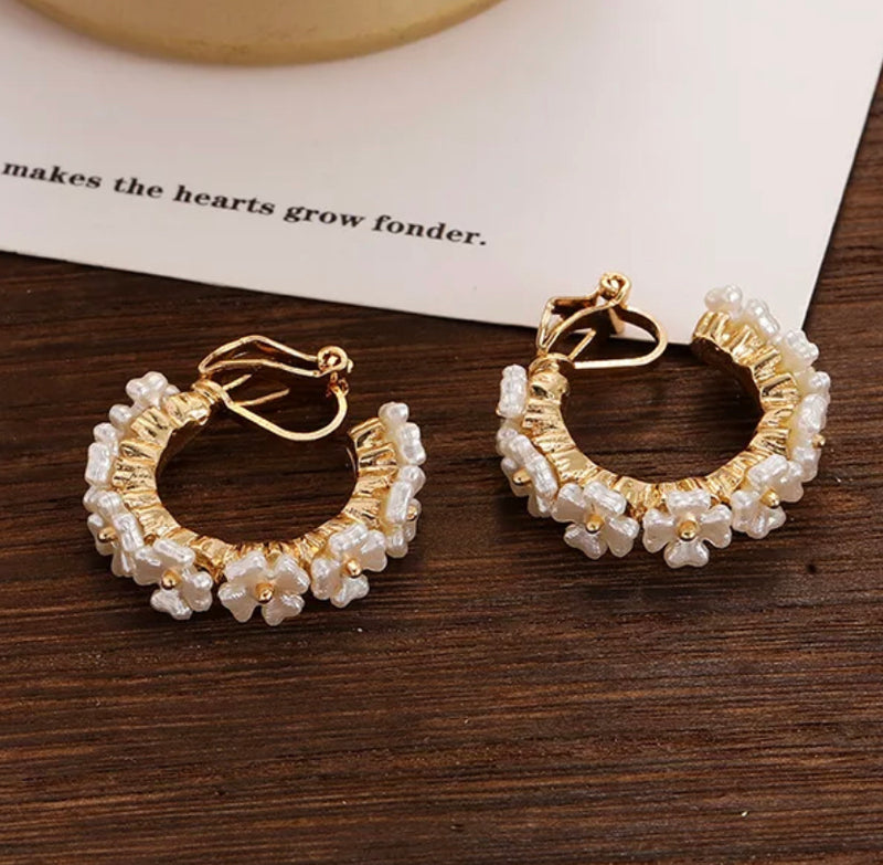 Clip on 1" gold and white flower hoop earrings with small clasp