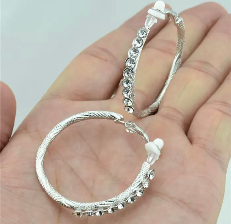 Clip on 1 3/4" textured silver hoop earrings with clear front stones