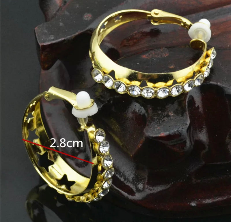 Clip on 1 1/4" gold wide hoop earrings with clear stones and stars