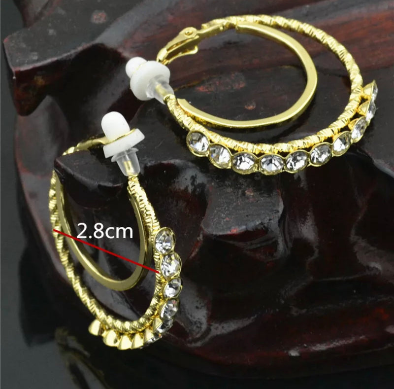 Clip on 1 1/4" gold double hoop earrings with front clear stones