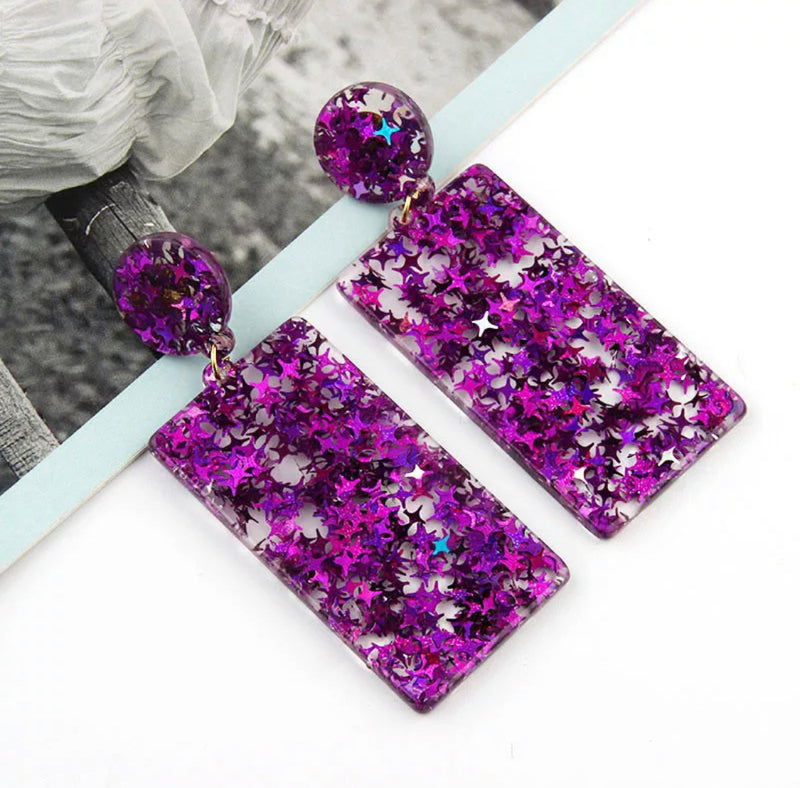 Clip on 3" gold and purple glitter star long dangle earrings