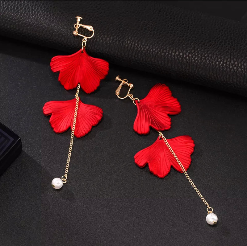 Clip on 5 1/4" long red petal earrings with gold chain and pearl