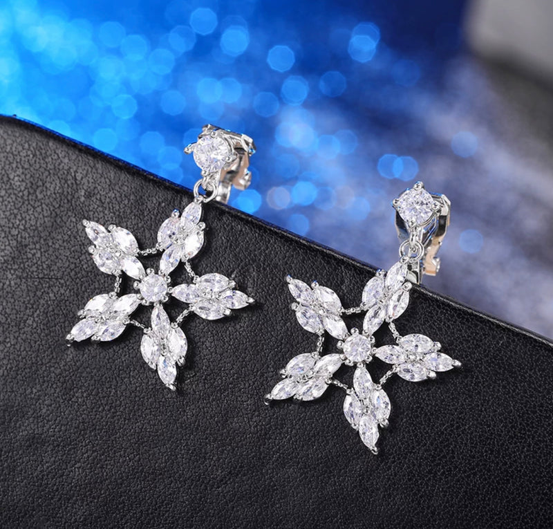 Clip on 1 1/4" silver or gold clear stone pointed snowflake earrings