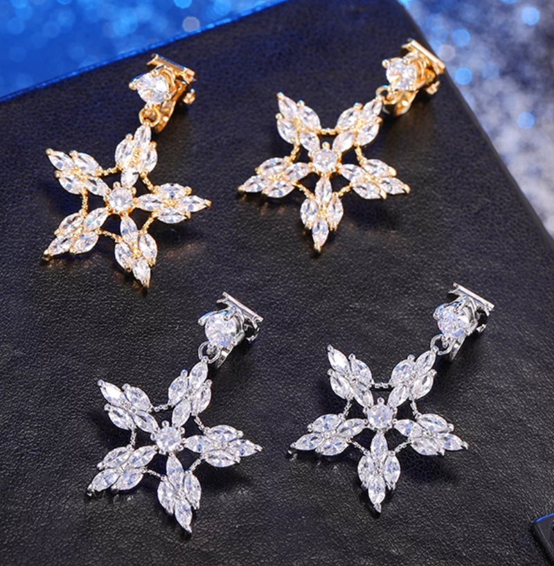 Clip on 1 1/4" silver or gold clear stone pointed snowflake earrings