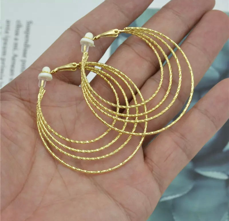 Clip on 2" medium gold four layer hoop earrings