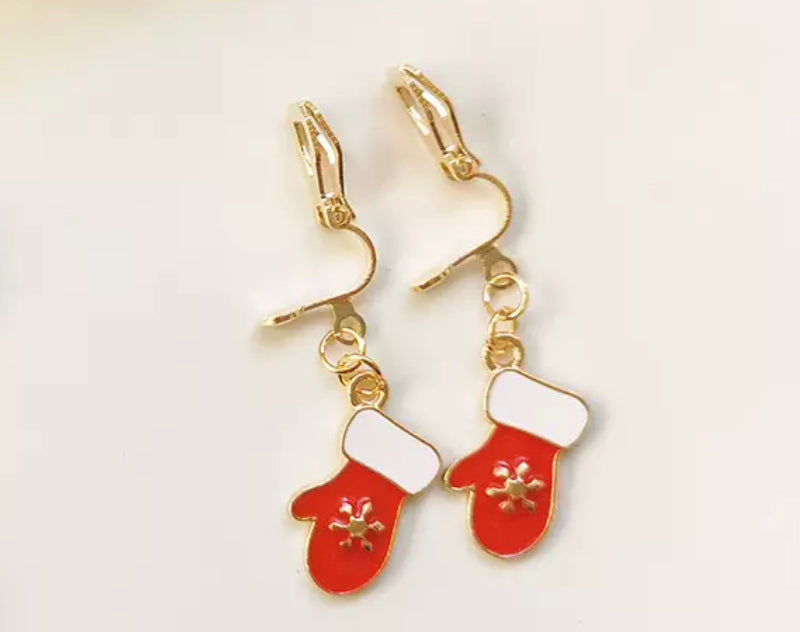 Clip on 1 1/2" gold, white and red dangle Christmas mitten earrings