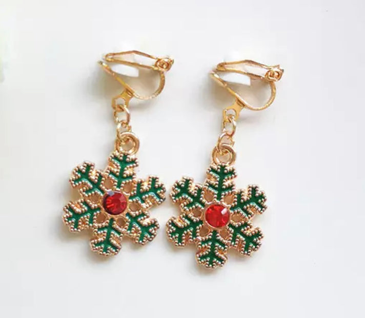 Clip on 1 1/2" gold dangle green snowflake earrings with red stone