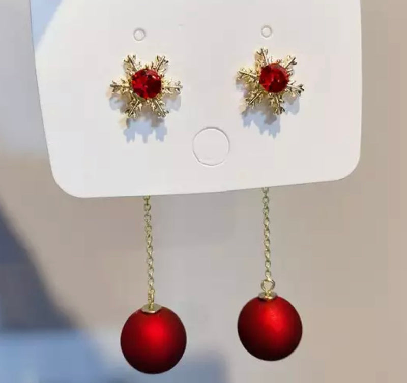 Pierced 3 1/2" gold snowflake chain dangle red bead earrings