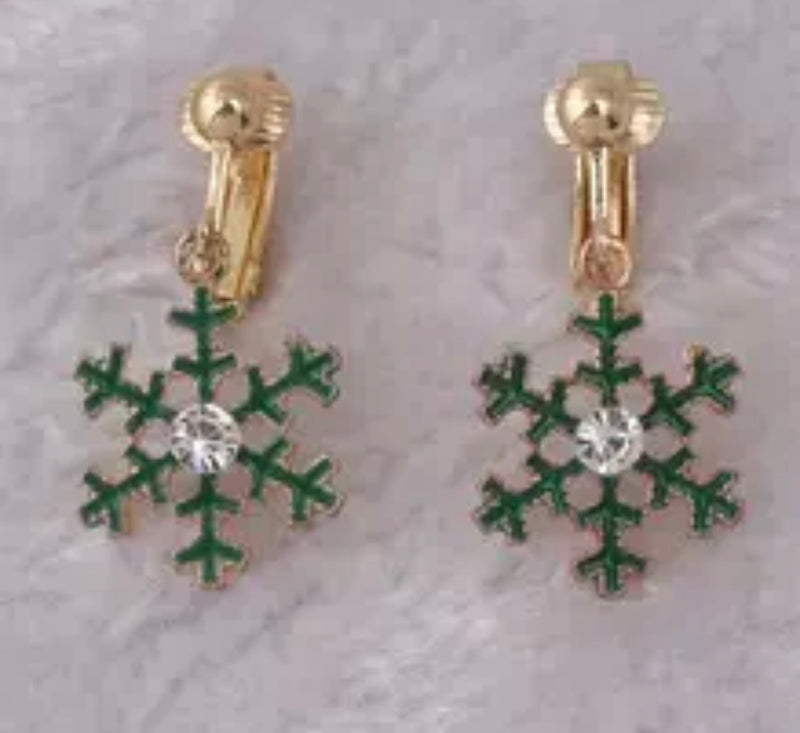 Clip on 1 1/2" gold dangle green snowflake earrings with clear stone