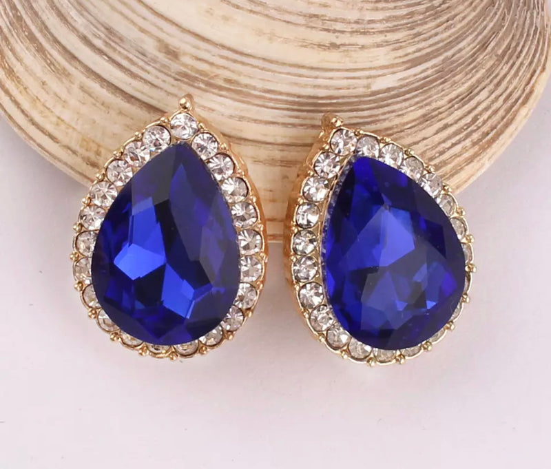 Clip on 1" gold teardrop earrings in a variety of color and clear stones