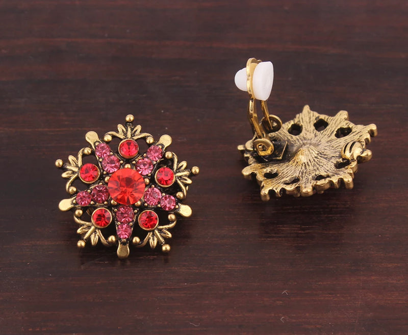 Vintage clip on 1" gold, pointed edge red and pink stone button style earrings