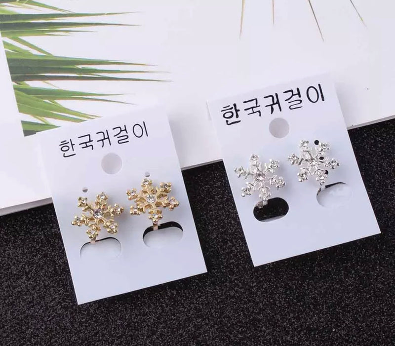 Clip on 1/2" silver or gold small snowflake earrings with clear stone