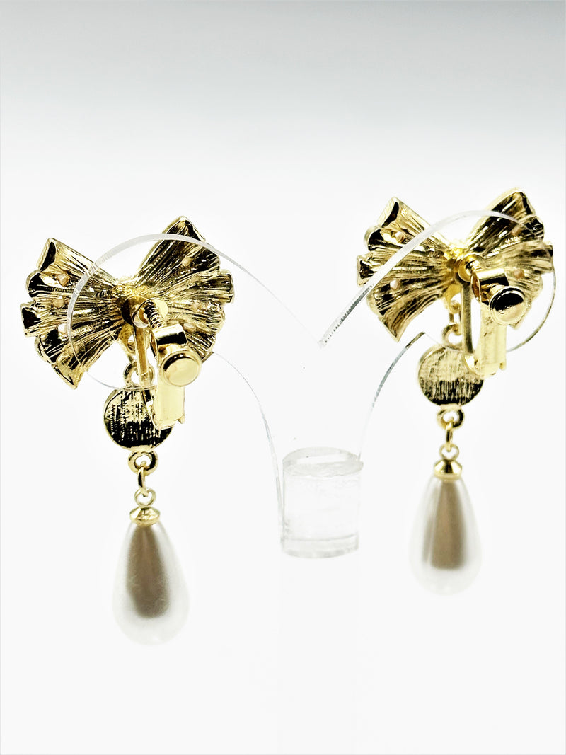 Clip on 2" gold dangle bow earrings with white pearls and clear stones