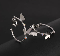 Clip on silver or gold butterfly hoop earrings w/pink fluorescent stones