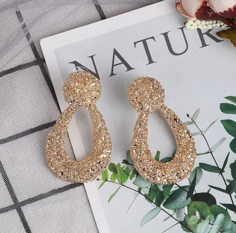 Trendy 2 1/4" gold pierced textured dangle teardrop earrings