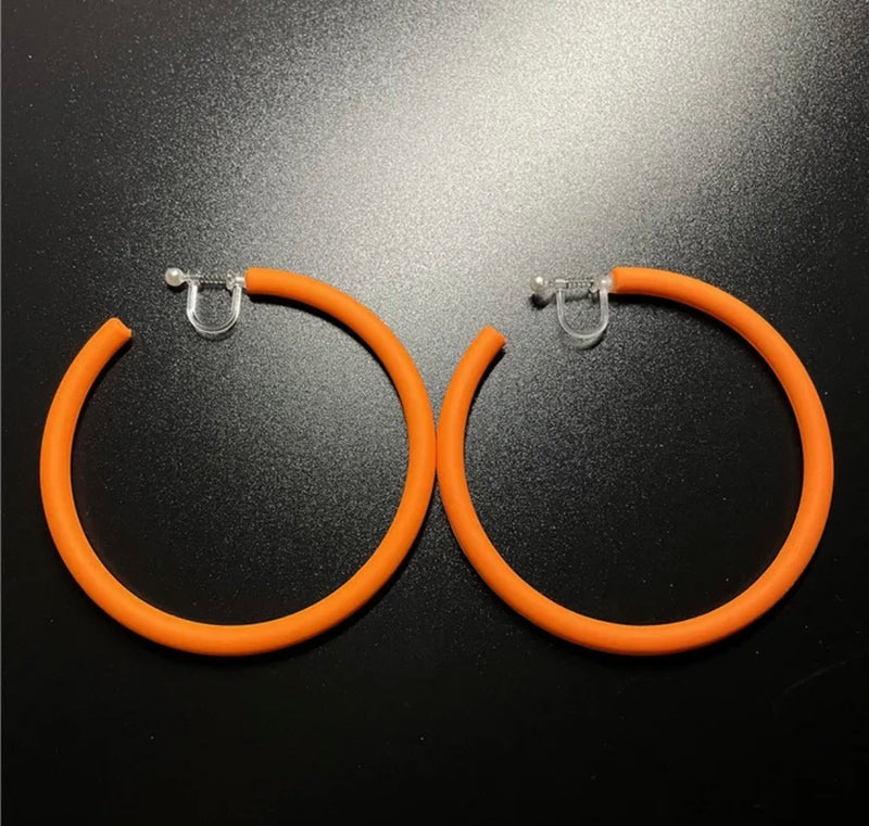 Trendy 2 1/2" clip on large plastic orange open back hoop earrings
