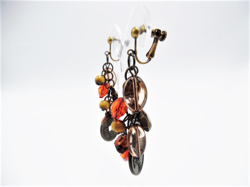 Clip on 3" long brass, brown, orange bead dangle heart earrings