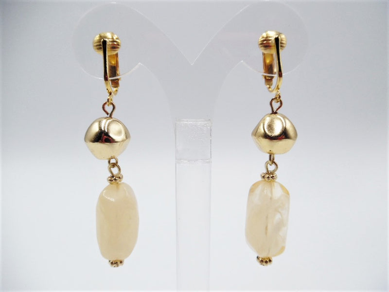 Clip on 2" bent gold and cream clear cream dangle earrings