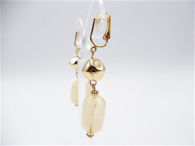 Clip on 2" bent gold and cream clear cream dangle earrings