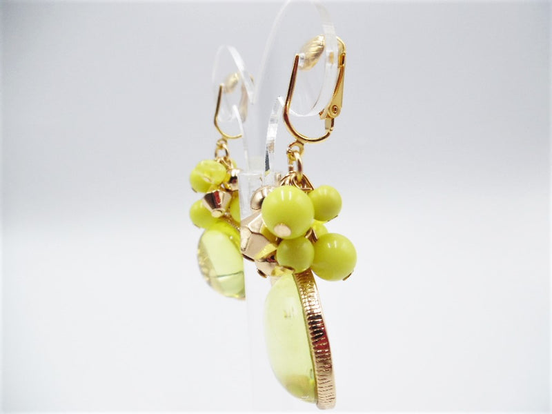 Clip on 2 1/2" gold and yellow cluster bead earrings with cutout inside stone