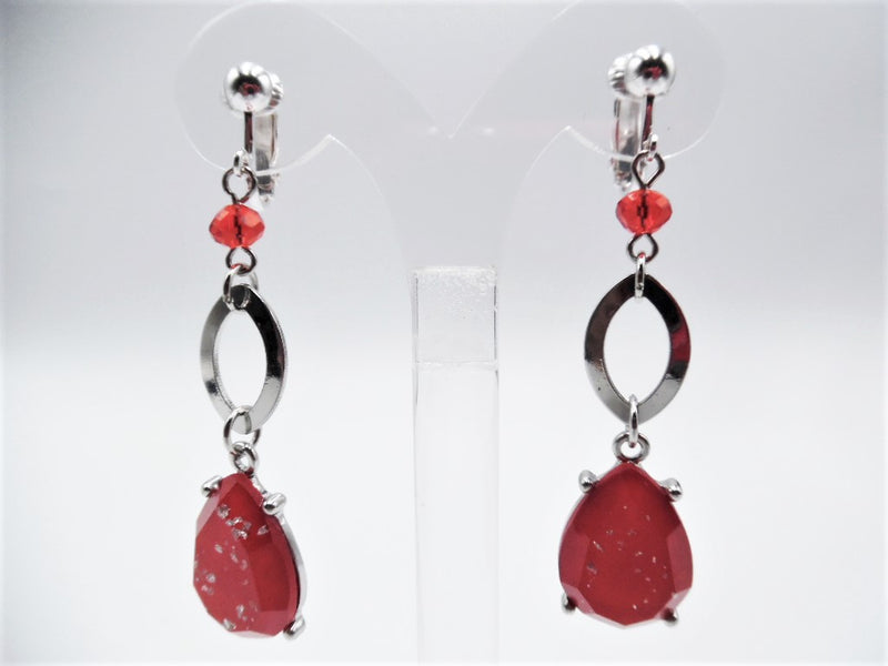 Clip on 2 1/2" silver and red bead earrings with dangle silver glitter teardrop