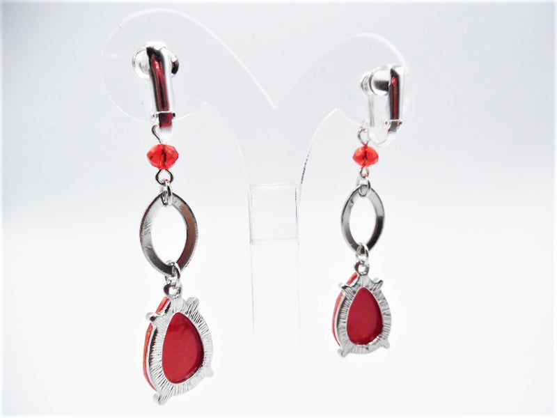 Clip on 2 1/2" silver and red bead earrings with dangle silver glitter teardrop