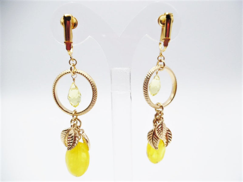 Clip on 3" gold dangle hoop earrings with yellow bead and leaves
