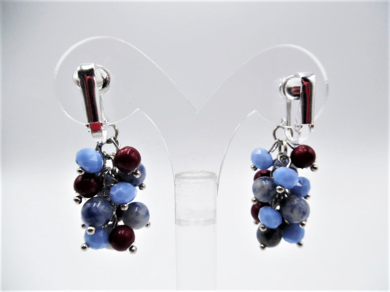 Clip on 1 3/4" silver earrings with dangle red, blue and silver beads