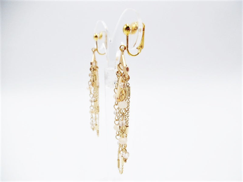 Clip on 3" long matte gold earrings with cream and gold beads