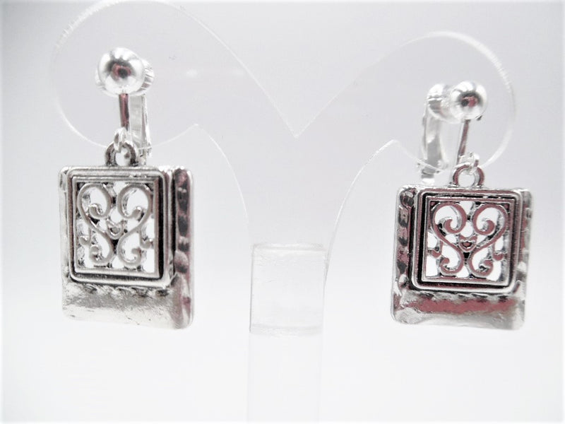 Clip on 1 1/2" silver hammered cutout square dangle earrings